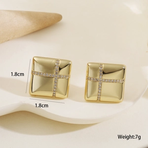 Detail showing 1.8cm square gold earrings with crystal-encrusted cross and size labels
