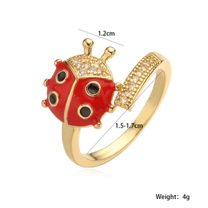 Macro shot of gold ladybug ring with red enamel details and cubic zirconia dimensions