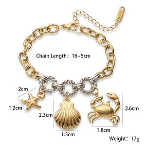 Detail showing 18K gold-plated starfish, shell, and crab charms on a mixed link chain