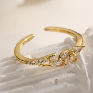 18K gold plated adjustable ring featuring sparkling zircon stones in a floral leaf design