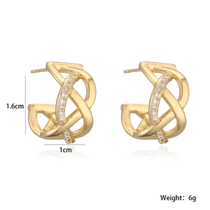 Detailed view of gold plated twisted geometric earrings with sparkling zircon stones
