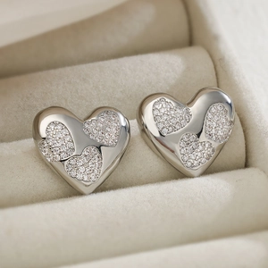 Elegant silver heart earrings with sparkling cubic zirconia in a jewelry box