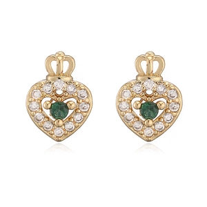 Macro detail of crown heart earrings with green gemstones and zircon stones