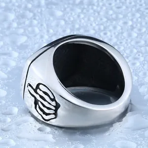 Punk style stainless steel wide ring featuring engraved middle finger skeletal hand design