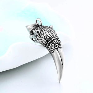 Vintage stainless steel wolf head and fang pendant with intricate engraved details