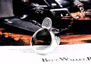 Macro side view of stainless steel punk skull ring showing detailed relief texture