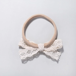 Soft nylon baby headband with white lace crochet bow for infant photography