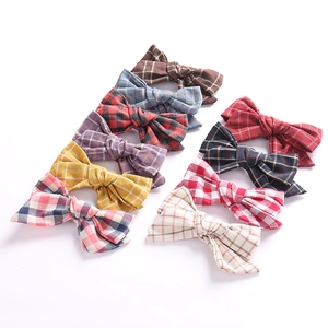 Detailed grid showing nine assorted colors and plaid patterns of cotton hair bow clips