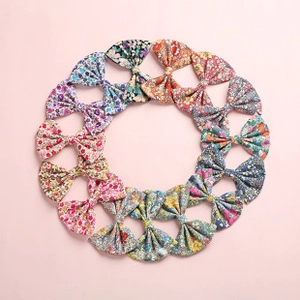 Detailed set of 12 colorful floral pattern nylon bow headbands for baby girls