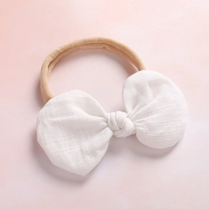 Cute white linen bow headband for baby with soft nude elastic nylon hair band