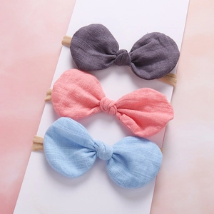 Three-piece linen bow baby headband set in purple, pink, and sky blue colors