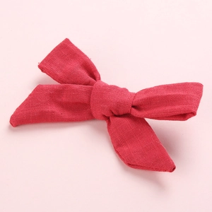 Classic red cotton linen bow hair clip for girls with elegant handcrafted texture