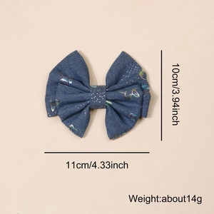Blue denim style bow hair clip with laser butterfly pattern and size dimensions