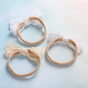 Set di 3 cerchietti per neonata con fiocco in pizzo ed elastico in nylon morbido