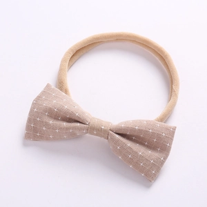 Detailed view of the soft elastic cotton baby headband with a star pattern bow accessory