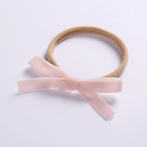 Elastic baby headband with pink velvet bow and soft nylon band for infants