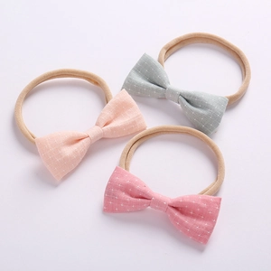 Set of 3 baby bow headbands in pink, blue and rose with white cross patterns
