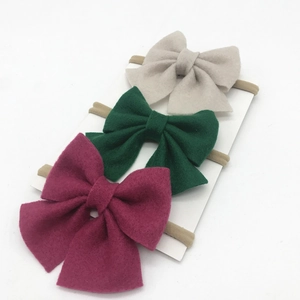 Three-piece infant bow headband set with beige, dark green, and rose felt bows