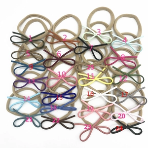 Lot de 25 bandeaux bébés en nylon avec nœuds en velours colorés en matrice 5x5