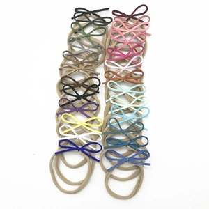 Détail de 20 bandeaux bébé en nylon élastique avec nœuds en velours de couleurs variées