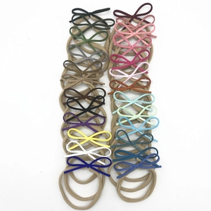 Lot de 20 bandeaux bébé en nylon haute élasticité avec nœuds en daim de couleurs variées