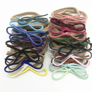 Détail de bandeaux pour bébé en nylon haute élasticité déclinés en 20 couleurs variées