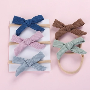 Detailed set of 5 corduroy bow headbands for baby girls in assorted Morandi colors