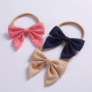 Three-piece baby bow headband set made of soft linen and nylon in pink navy and brown