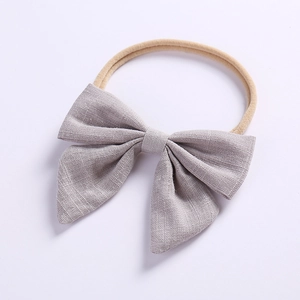 Light gray linen bow baby headband with soft nylon elastic band on white background