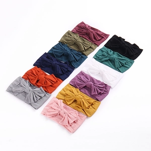 Lot de 12 bandeaux bébé en nylon souple avec grands nœuds papillon colorés