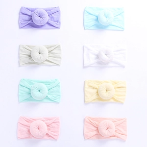 Set of 8 colorful nylon donut headbands for babies in soft pastel knit fabrics