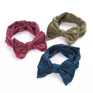 Three-piece baby bow headband set in burgundy, olive, and navy soft elastic fabric