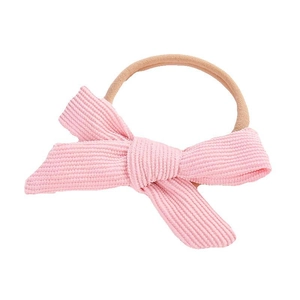 Pink corduroy bow headband for newborn girls with soft elastic nylon band for comfort