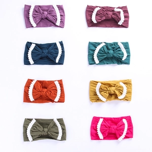 Detail view of 8-piece baby headband set with lace bowknots in various colors