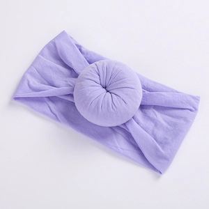 Detail view of light purple nylon donut headband with soft pleated circular knot decoration