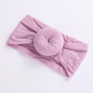 Close-up of a soft lavender elastic nylon headband featuring a sweet donut knot design