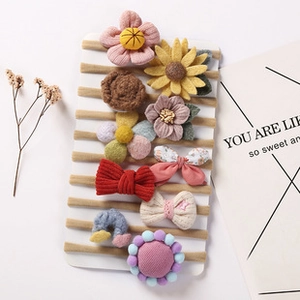 Detailed set of 10 handmade infant hairbands with floral and bow motifs in soft colors