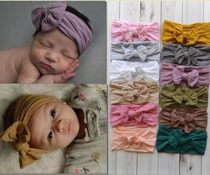 Detailed collage of colorful nylon baby headbands with large bows for infant photography
