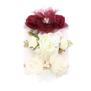 Detailed set of three handmade bohemian floral headbands for babies with elastic nylon bands
