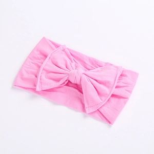 Elastic wide pink bow headband for babies made of soft breathable fabric