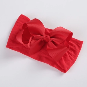 Detail of soft nylon red headband with a large 5-inch ribbed grosgrain bow for babies