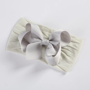 Detail showing high-elasticity soft nylon band and a large grey textured grosgrain bow