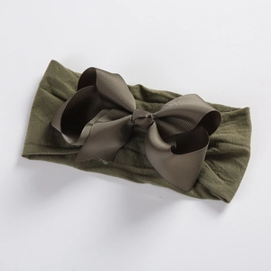 Detail view of olive green grosgrain ribbon bow on soft nylon headband for babies