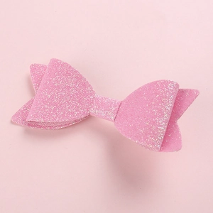 Makroaufnahme von 3D pink glitzernde Haarschleife mit funkelnder Textur und Material