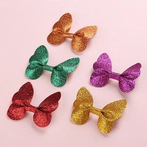 Set of five glitter 3D butterfly hair clips for children in diverse vibrant colors