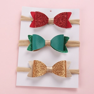 Lot de trois bandeaux bébé avec nœuds pailletés en rouge, vert et or festif