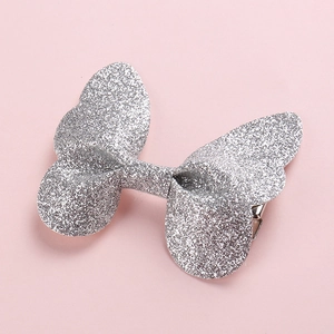 Detail of silver glitter butterfly hair clip for girls with shimmering 3D finish