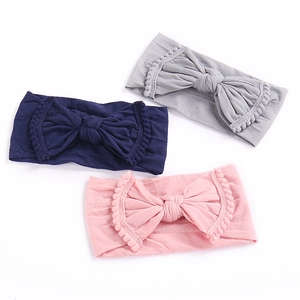 Set van 3 zachte babyhaarbanden met grote strikken en pomponkant in grijs, marineblauw en roze