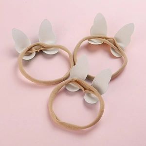 Lot de trois bandeaux papillon à paillettes beiges pour bébés sur bandes de nylon élastiques