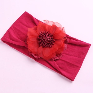 Macro detail of high-elasticity wide nylon baby headband with 3D chiffon flower